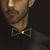 Man in Black Suit wearing Gold Polished structural Bowtie for men
