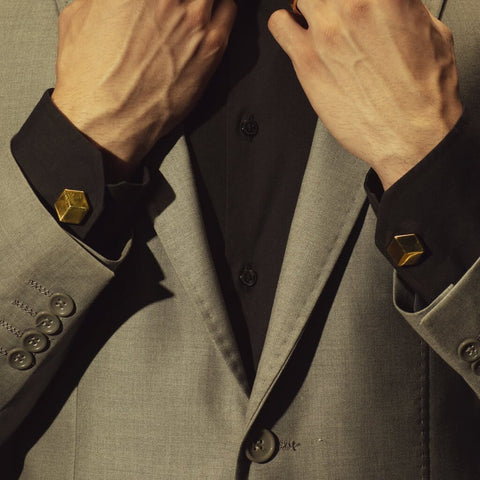 Man in Suit wearing The Cube gold plated cufflinks