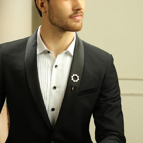 Man in Black Suit wearing The Interlocked Gold Plated Lapel Pins