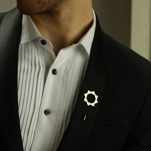 Chest View of a Man in Black Suit wearing The Interlocked Gold Plated Lapel Pins