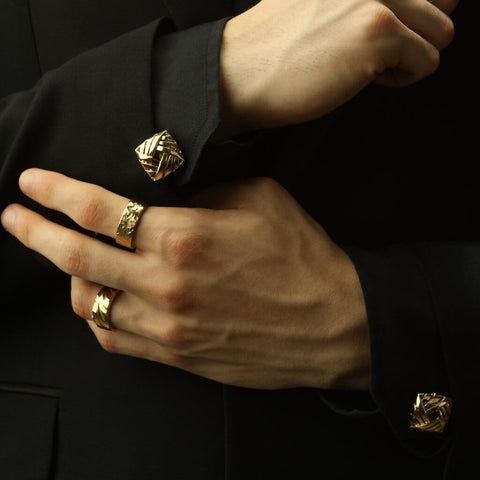 Man's Hand wearing The cyclone cufflinks made using Gold Plated Sterling Silver 