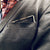 Man in Black suit wearing Gold Polished The King Post Pocket Square